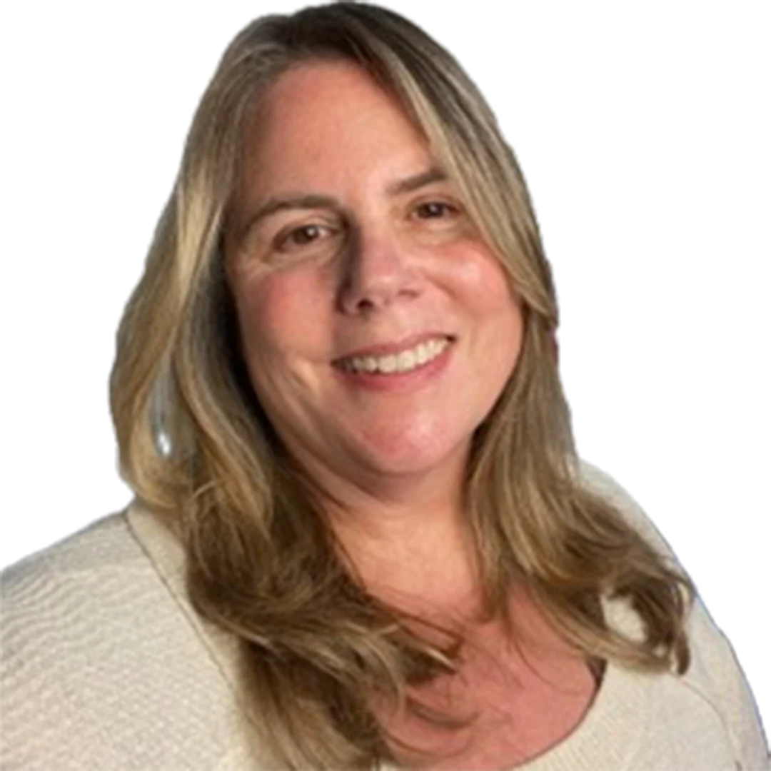 Lisa Morrell smiling in front of a neutral background, wearing a cream sweater with long blonde hair.